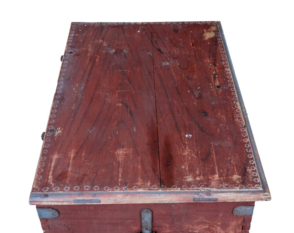 A 19th-century red-painted pine blanket box featuring white hand-painted script dated 1828 and wrought iron corner brackets. View VI