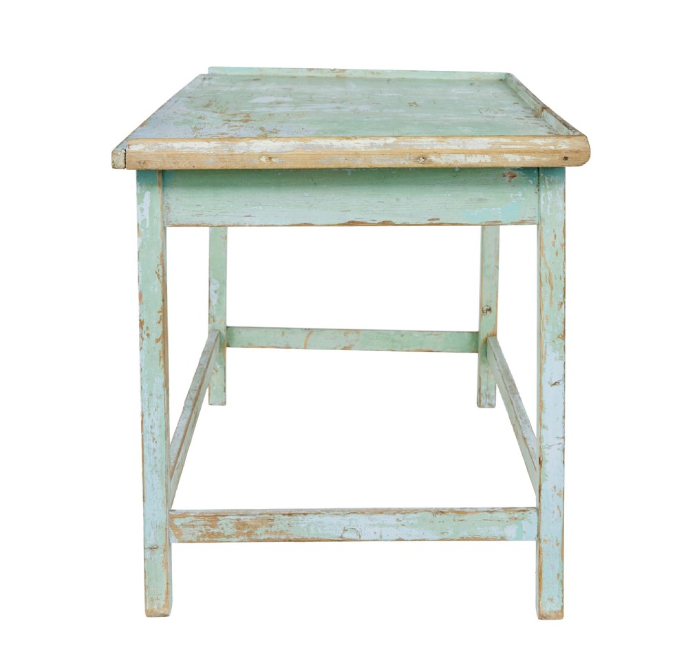A 19th-century Swedish baking table featuring a pale green painted finish, a raised perimeter edge, and square legs connected by stretchers. View III