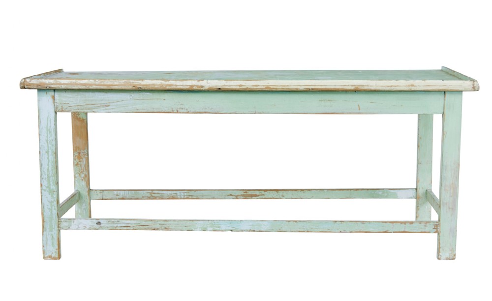 A 19th-century Swedish baking table featuring a pale green painted finish, a raised perimeter edge, and square legs connected by stretchers. View V