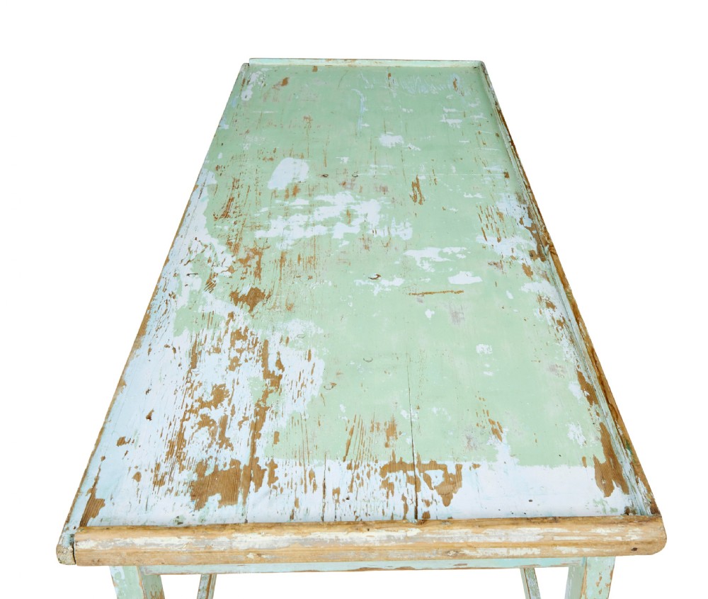 A 19th-century Swedish baking table featuring a pale green painted finish, a raised perimeter edge, and square legs connected by stretchers. View VI