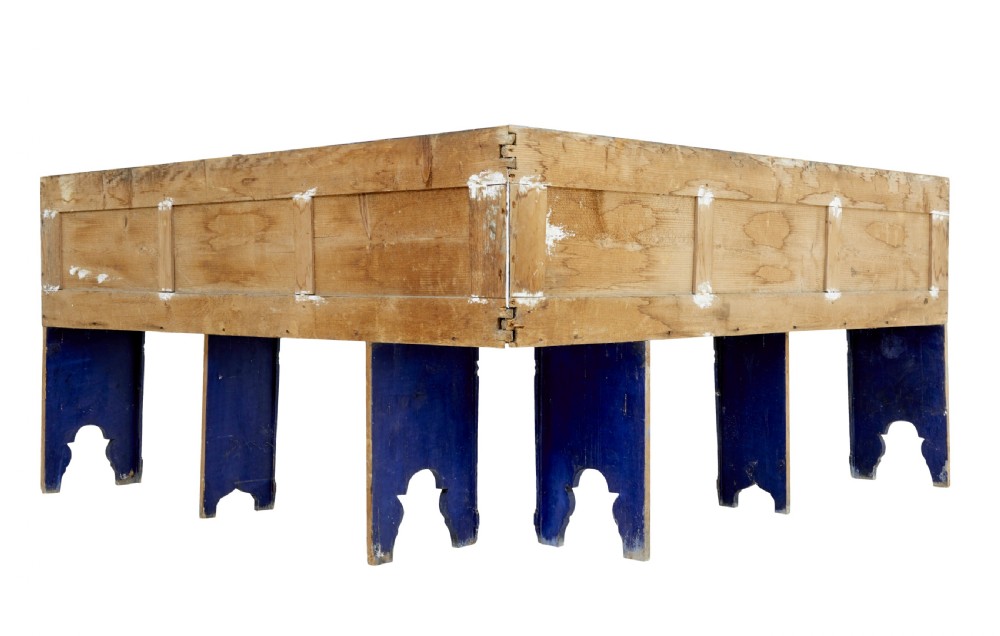A nineteenth-century L-shaped wooden corner bench featuring hand-painted floral panels in red, green, and orange over a deep blue frame. View V
