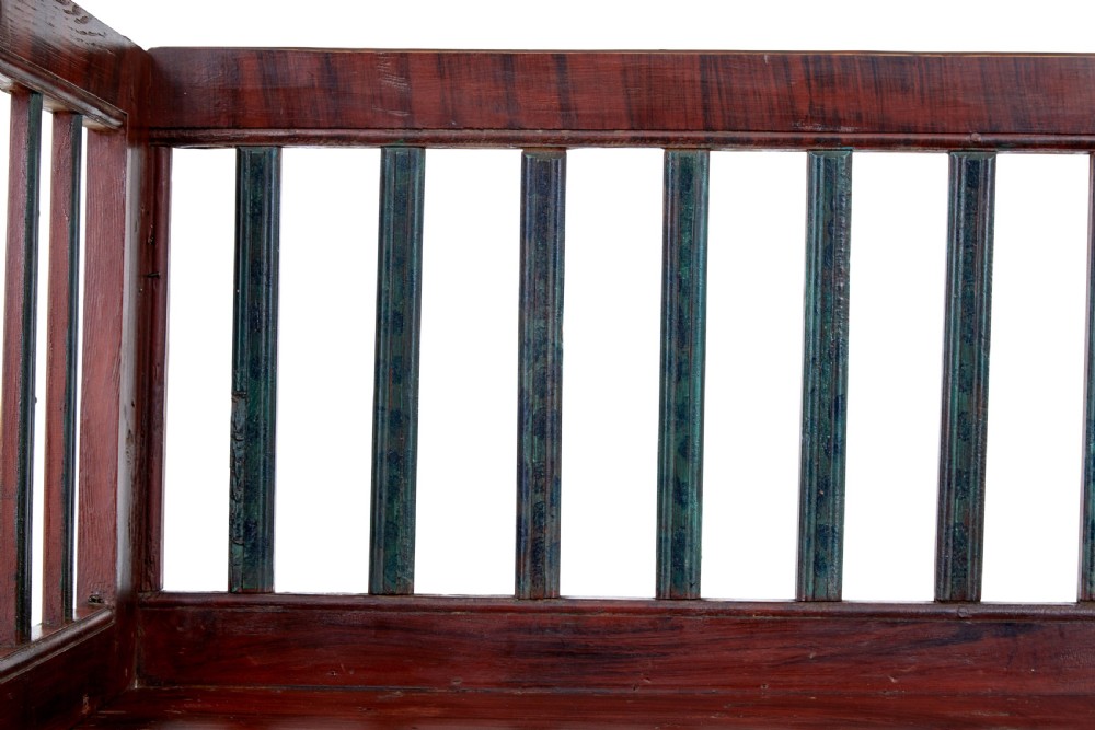A mid 19th-century Swedish rustic pine bench featuring a dark red painted finish, a spindle backrest with contrasting dark green slats, and an enclosed box base. View IV