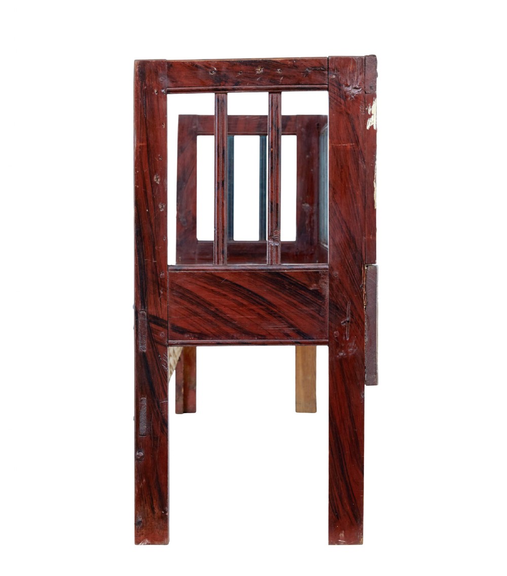 A mid 19th-century Swedish rustic pine bench featuring a dark red painted finish, a spindle backrest with contrasting dark green slats, and an enclosed box base. View VIII