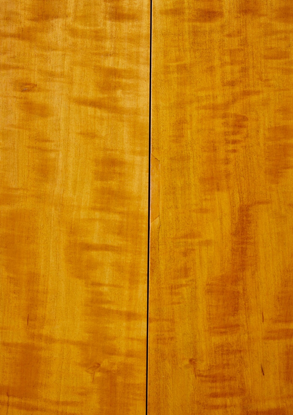 A mid-century modern double-door wardrobe crafted from figured golden birch wood with short tapered legs. View VIII