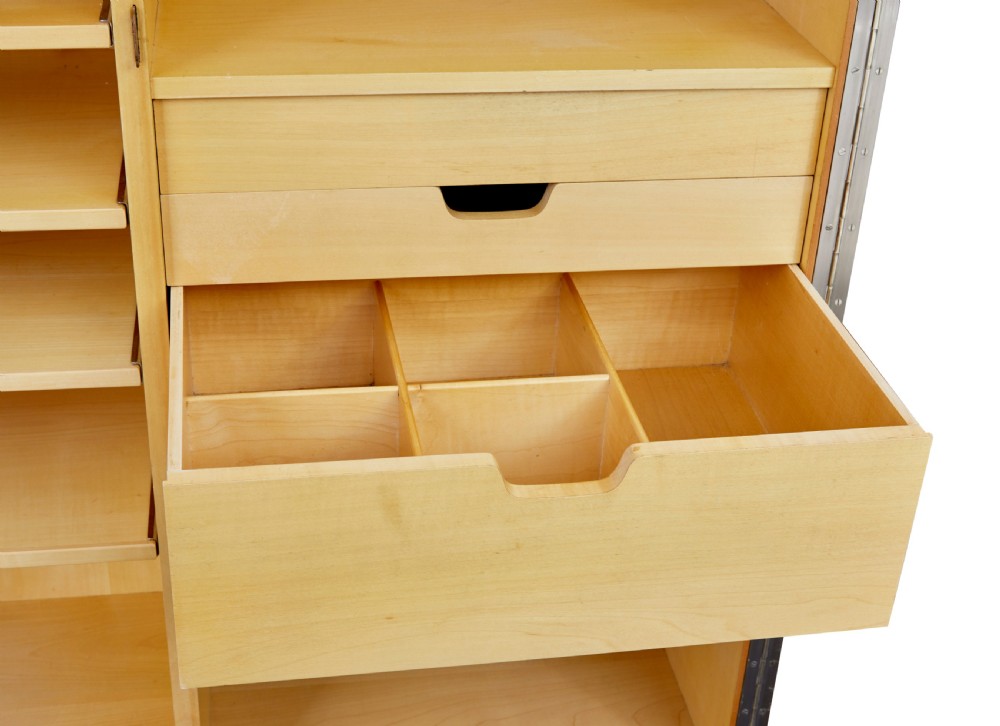 A mid-century modern double-door wardrobe crafted from figured golden birch wood with short tapered legs. View X