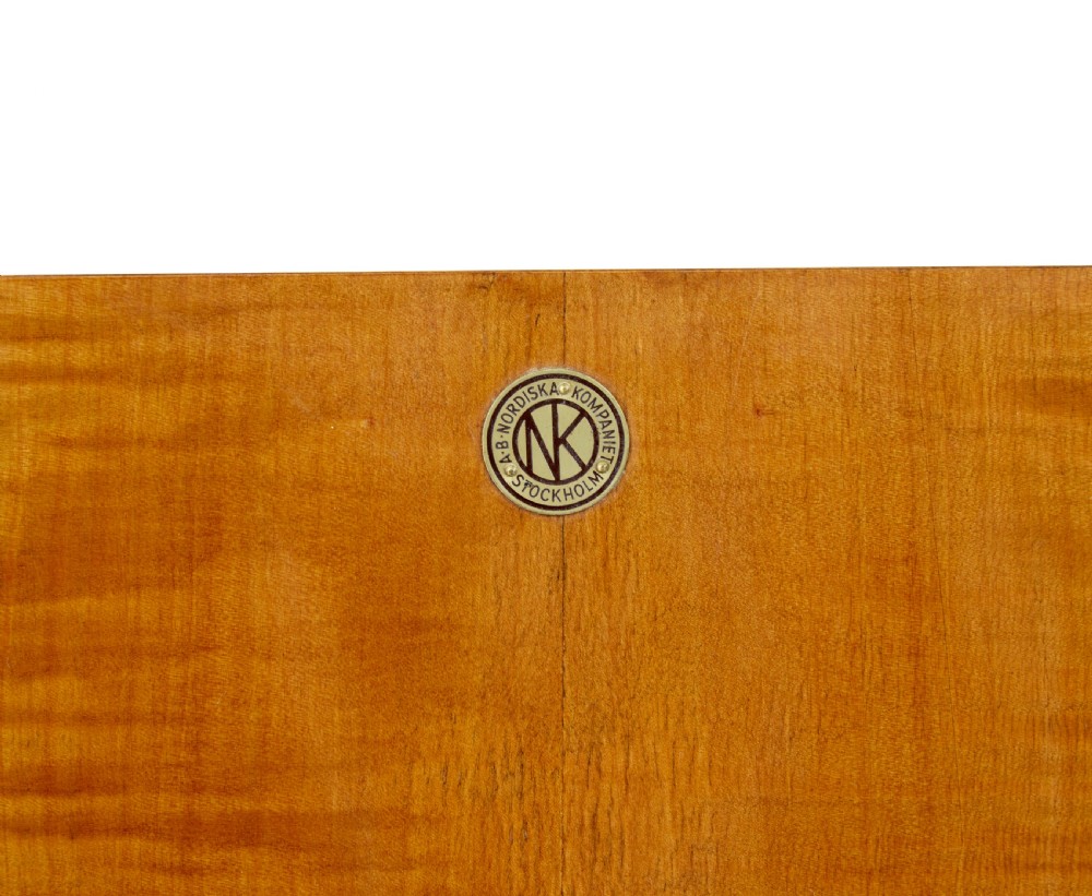 A mid-century modern double-door wardrobe crafted from figured golden birch wood with short tapered legs. View XII