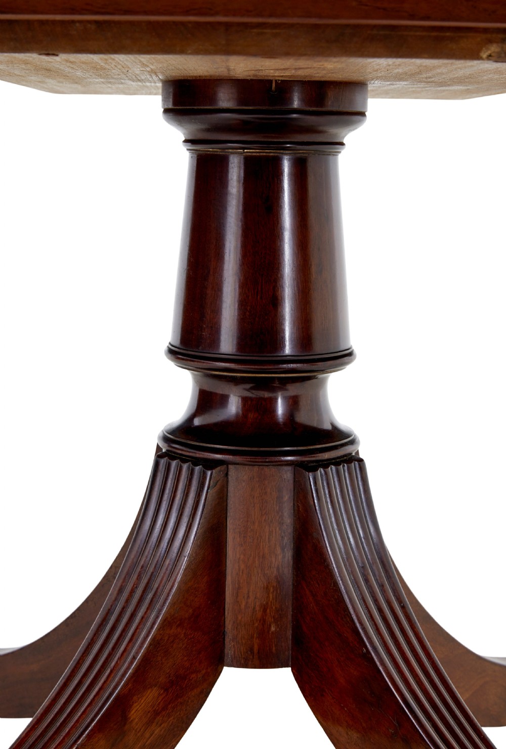 An early 19th-century Regency mahogany breakfast table featuring an inlaid rectangular top with rounded corners, supported by a turned pedestal and four reeded legs with brass castors. View V