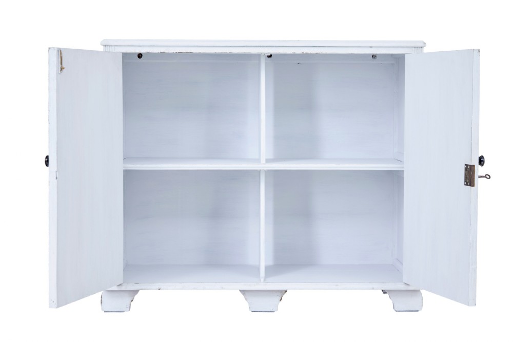 A 19th-century Swedish two-door cupboard painted in off-white, featuring simple panelled doors and small brass knobs. View II