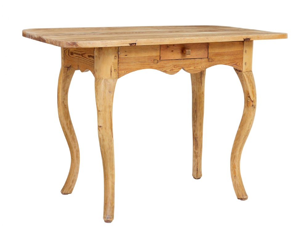 A 19th-century Swedish Rococo Revival side table made of natural scrubbed pine featuring cabriole legs and a single small drawer.