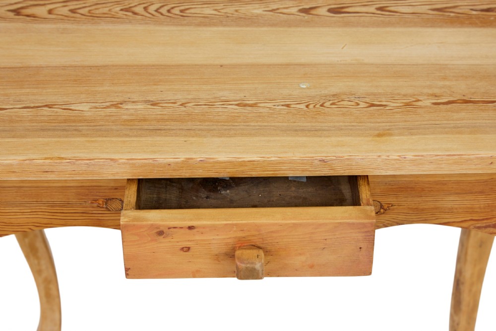A 19th-century Swedish Rococo Revival side table made of natural scrubbed pine featuring cabriole legs and a single small drawer. View VIII