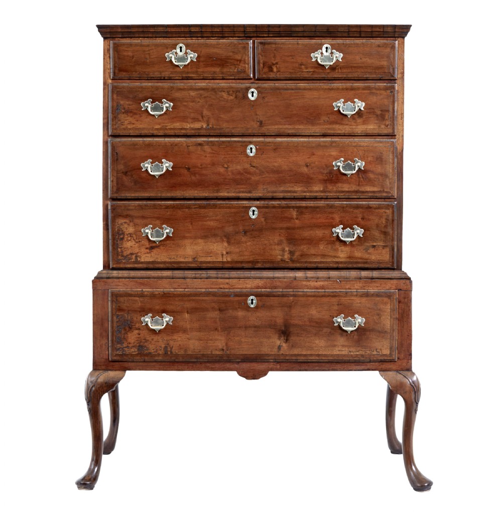 A late 17th-century William and Mary walnut chest on stand featuring five upper drawers, a single base drawer, decorative brass backplate handles, and cabriole legs. View II