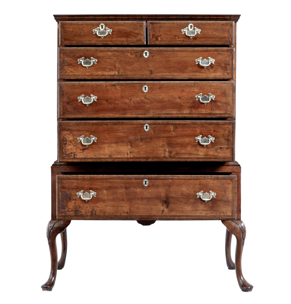 A late 17th-century William and Mary walnut chest on stand featuring five upper drawers, a single base drawer, decorative brass backplate handles, and cabriole legs. View III
