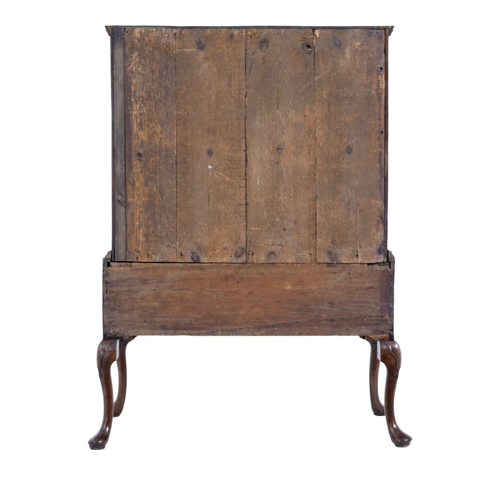 A late 17th-century William and Mary walnut chest on stand featuring five upper drawers, a single base drawer, decorative brass backplate handles, and cabriole legs. View VI