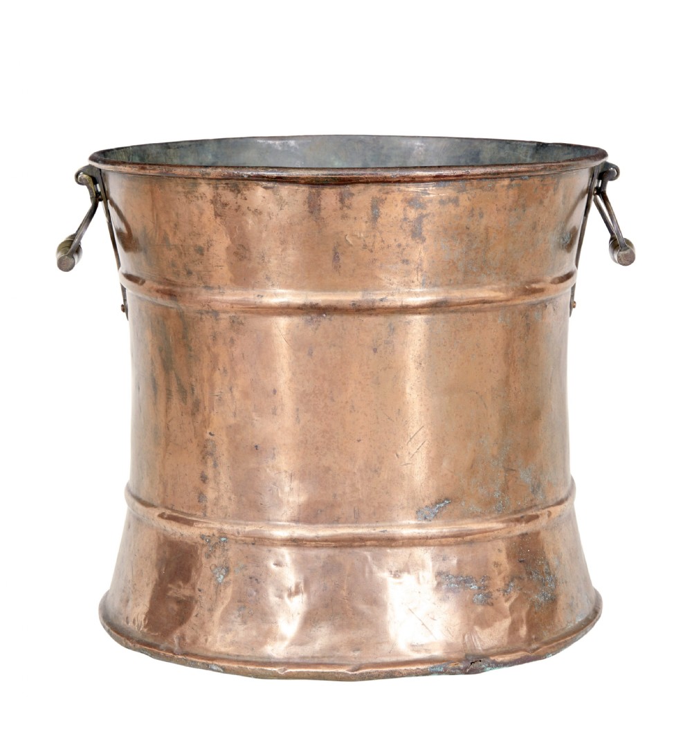 A cylindrical 19th-century copper vessel with horizontal ribbed banding and cast brass side handles. View III
