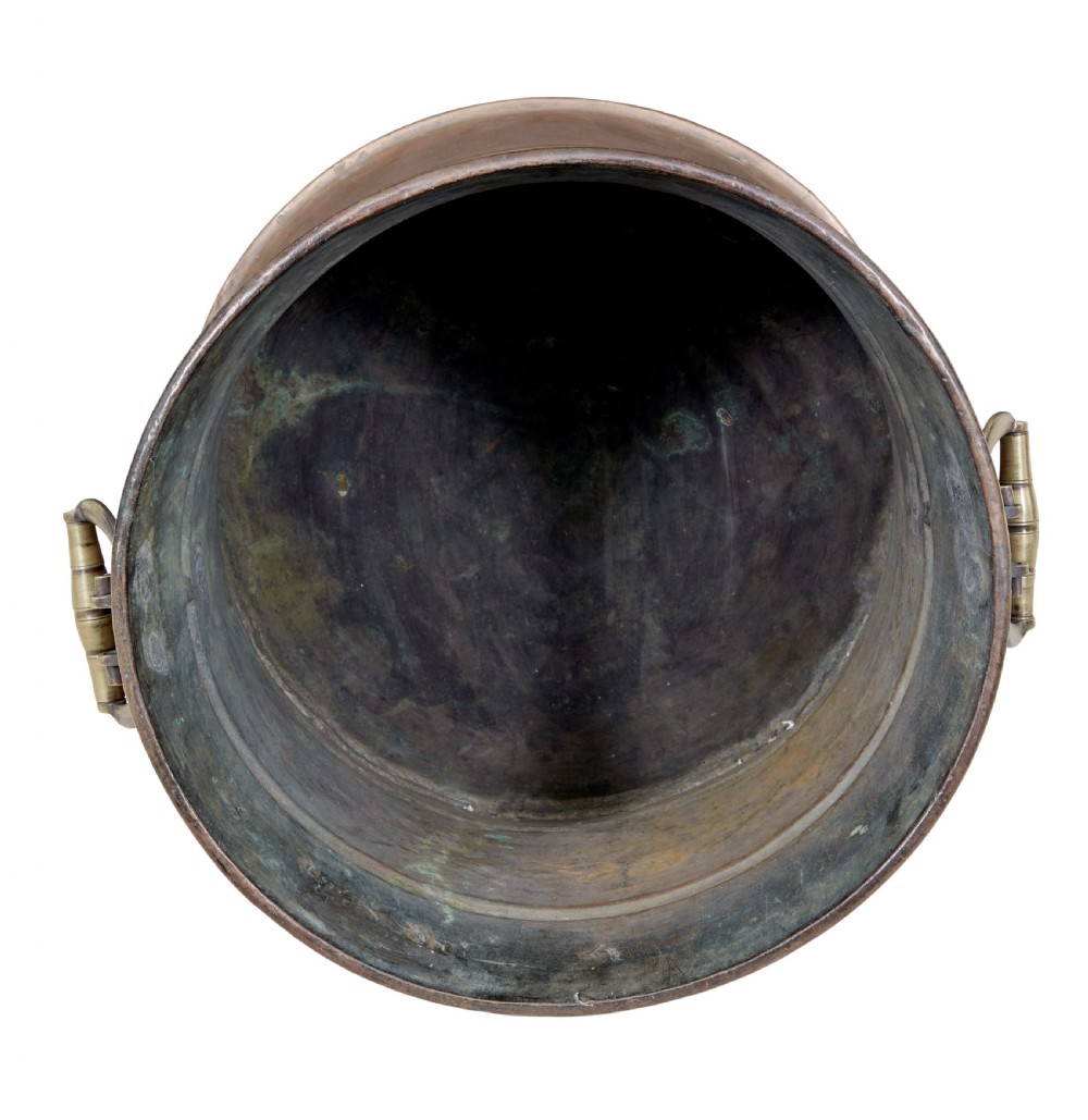 A cylindrical 19th-century copper vessel with horizontal ribbed banding and cast brass side handles. View IV
