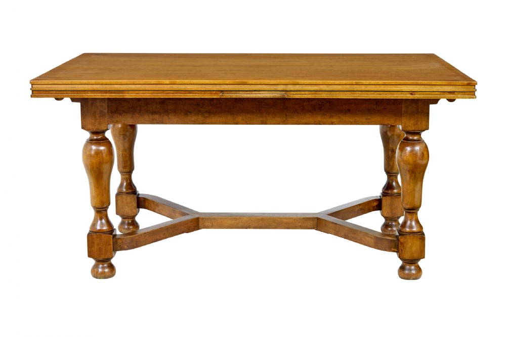 An early 20th-century birch extending dining table with a rectangular top, turned baluster legs, and a low central stretcher base. View II