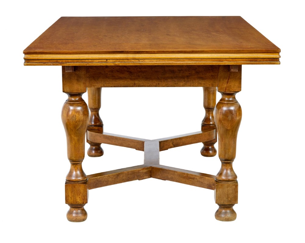 An early 20th-century birch extending dining table with a rectangular top, turned baluster legs, and a low central stretcher base. View III