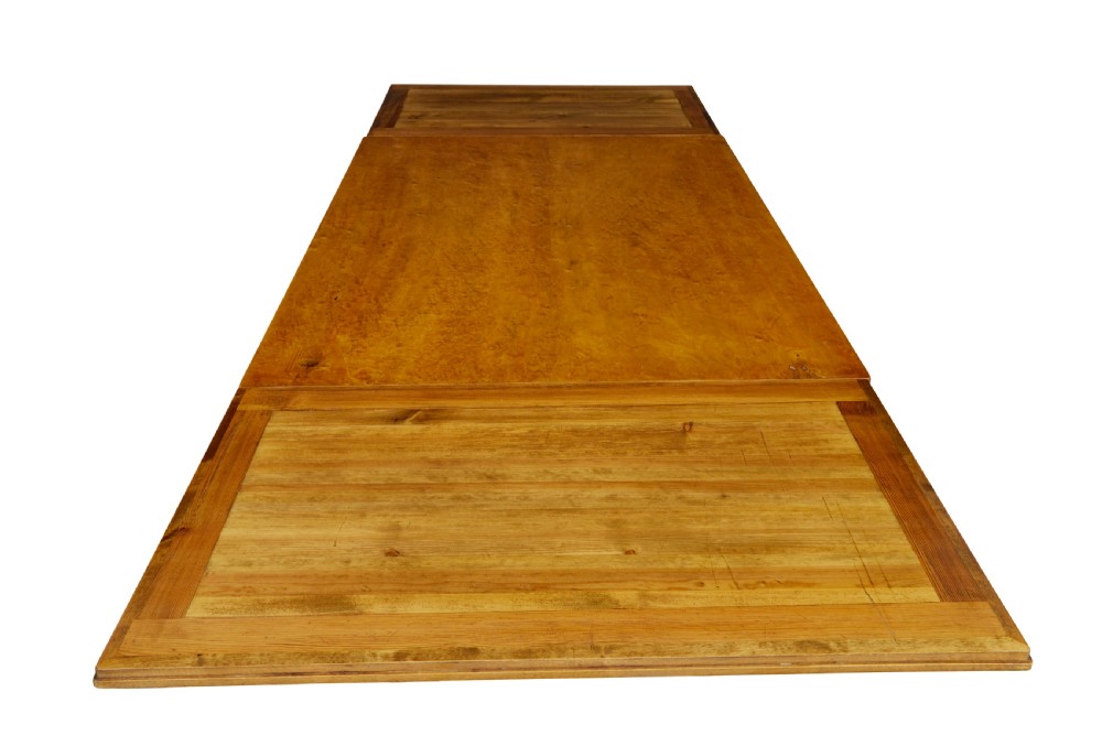 An early 20th-century birch extending dining table with a rectangular top, turned baluster legs, and a low central stretcher base. View VII