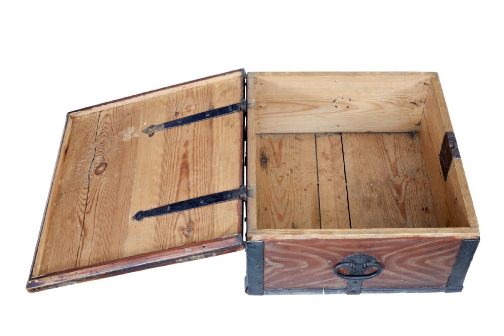A 19th-century Scandinavian pine strongbox featuring a hand-painted faux grain finish in reddish-brown with forged iron corner mounts, base straps, and an iron escutcheon plate. View III