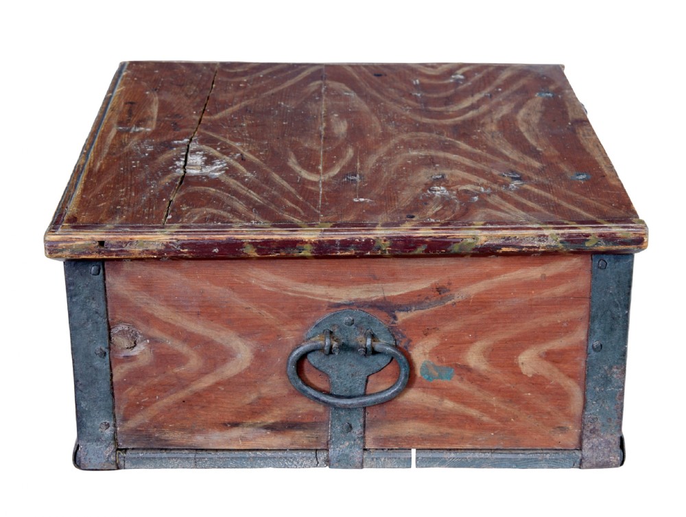 A 19th-century Scandinavian pine strongbox featuring a hand-painted faux grain finish in reddish-brown with forged iron corner mounts, base straps, and an iron escutcheon plate. View IV