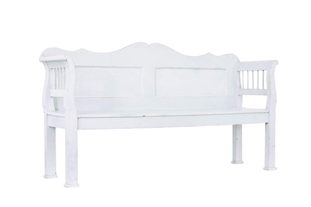 A white painted nineteenth-century Swedish Gustavian style wooden bench featuring a shaped crest rail, panelled back, and slatted side armrests.