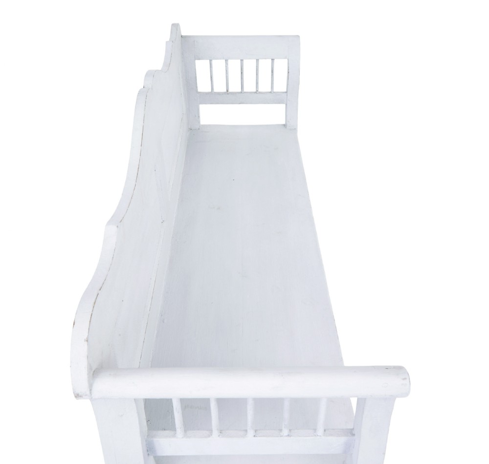 A white painted nineteenth-century Swedish Gustavian style wooden bench featuring a shaped crest rail, panelled back, and slatted side armrests. View VI