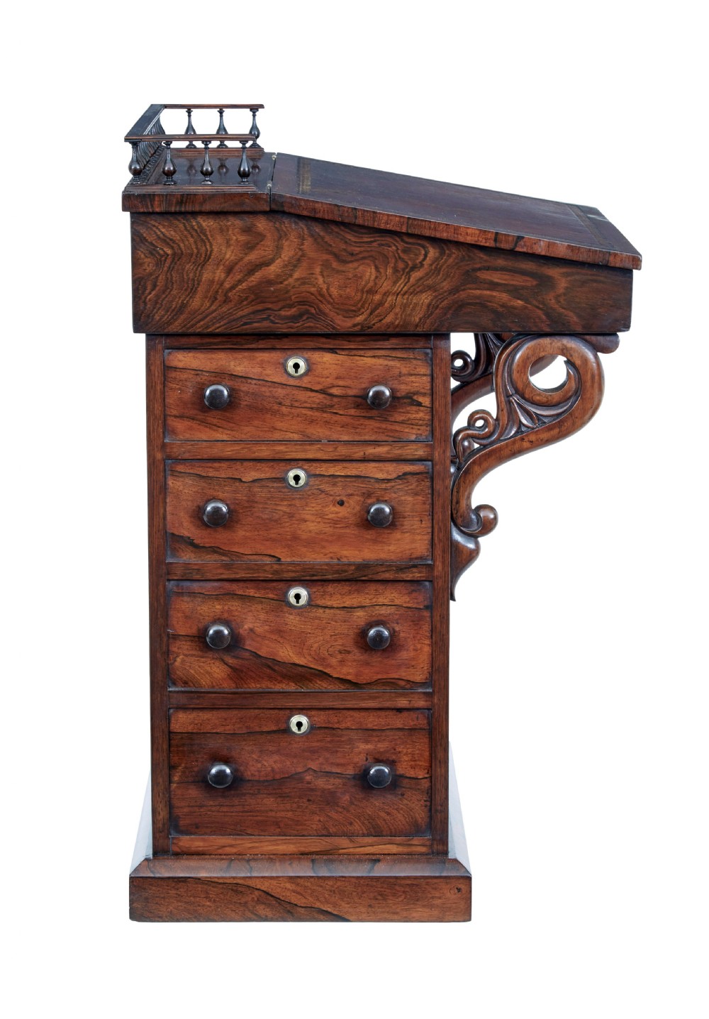 A 19th-century Regency palisander Davenport desk featuring a sloped leather writing top, carved scroll brackets, side drawers, and a brass spindle top gallery. View IX