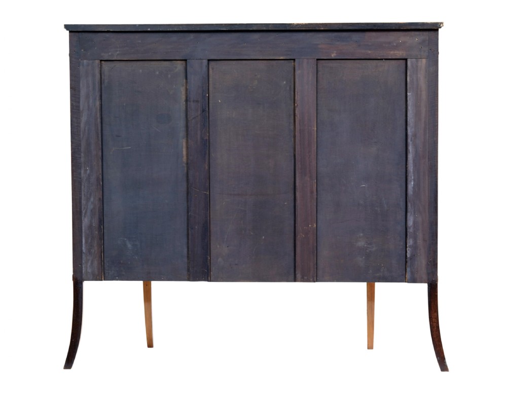 A late 19th-century Sheraton Revival satinwood cabinet featuring hand-painted floral swags, classical figurative oval panels, intricate wood marquetry, and tapered legs. View V