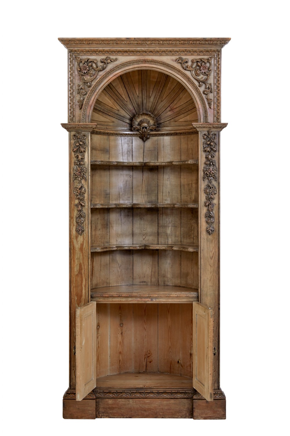 An 18th-century carved pine corner cabinet featuring a vaulted dome top with a shell carving, floral pilasters, open shelves, and a double-door base. View II