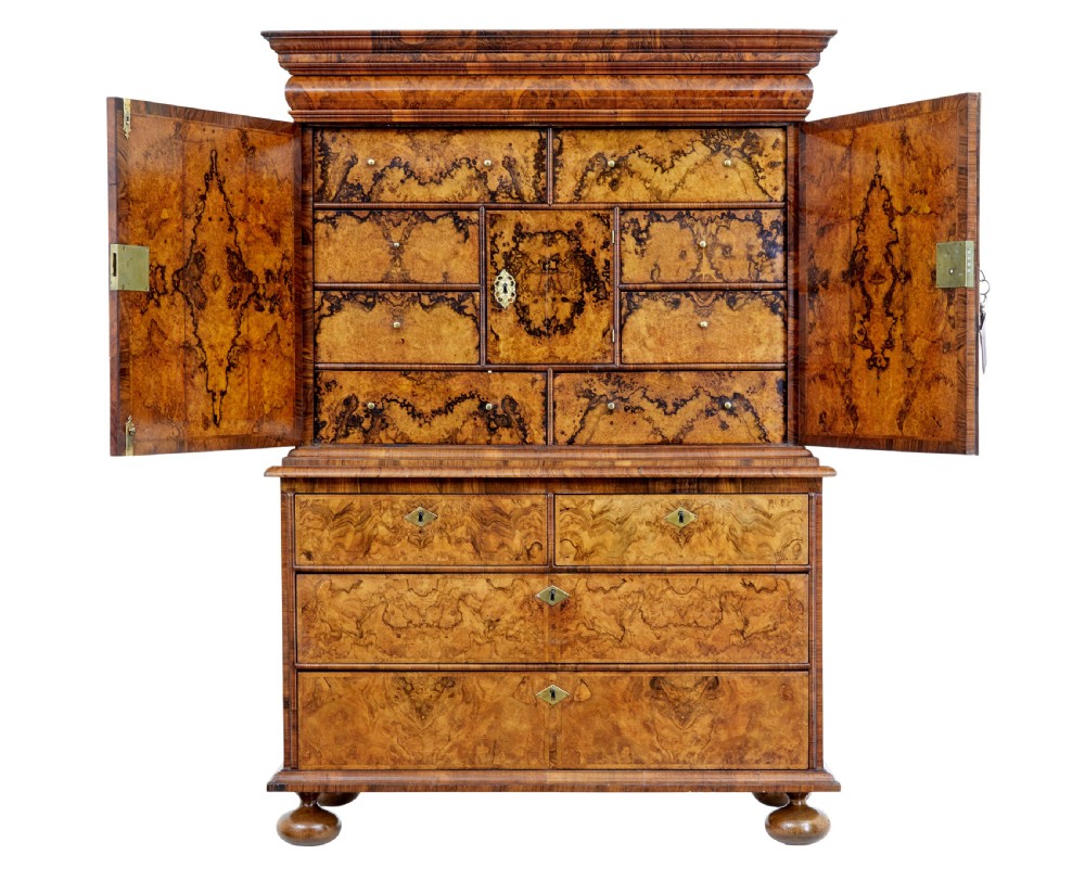 An 18th-century George I burr walnut cabinet on chest featuring double upper doors, brass keyhole escutcheons, and turned bun feet. View III