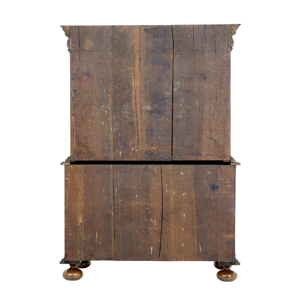 An 18th-century George I burr walnut cabinet on chest featuring double upper doors, brass keyhole escutcheons, and turned bun feet. View VII