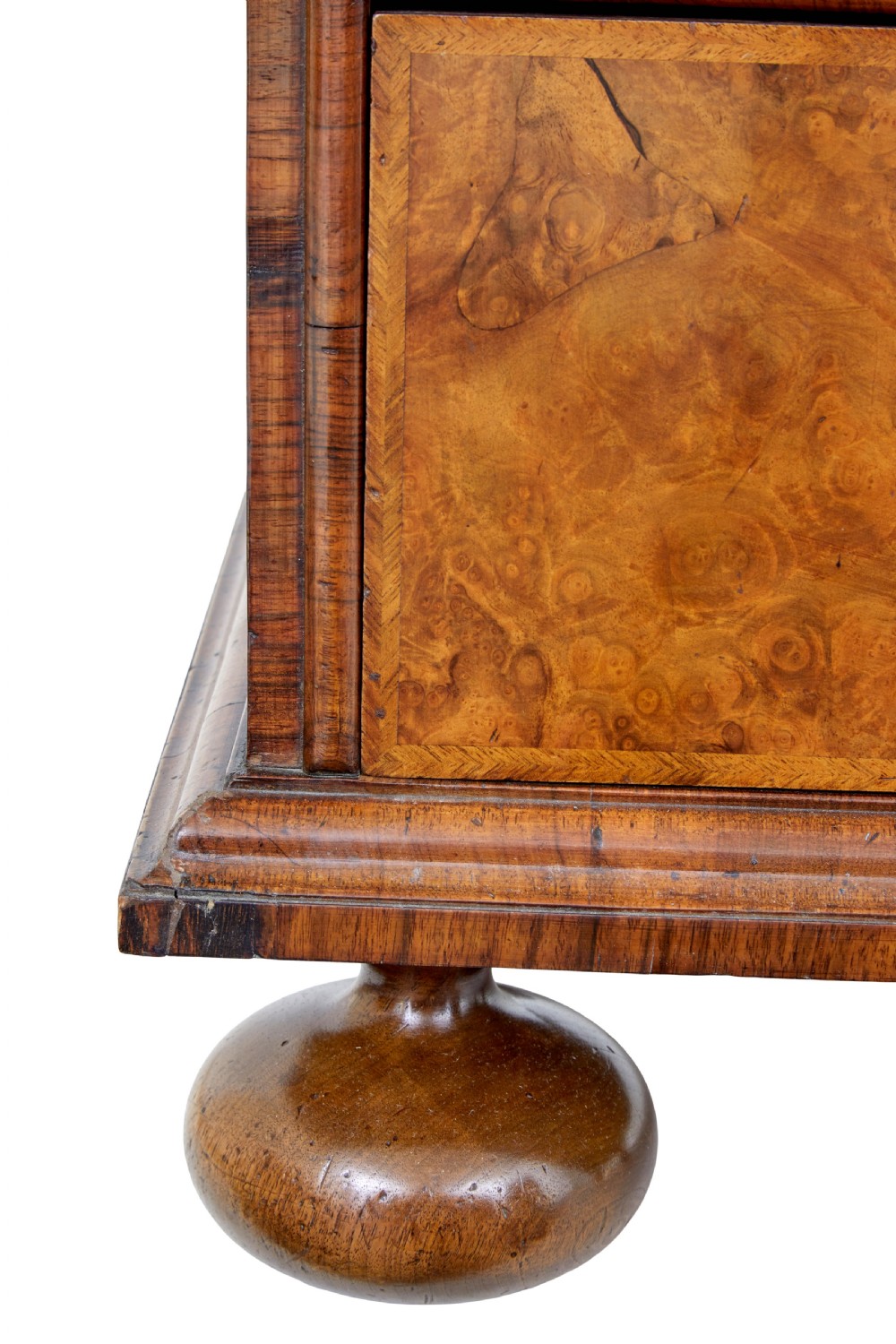 An 18th-century George I burr walnut cabinet on chest featuring double upper doors, brass keyhole escutcheons, and turned bun feet. View XVIII