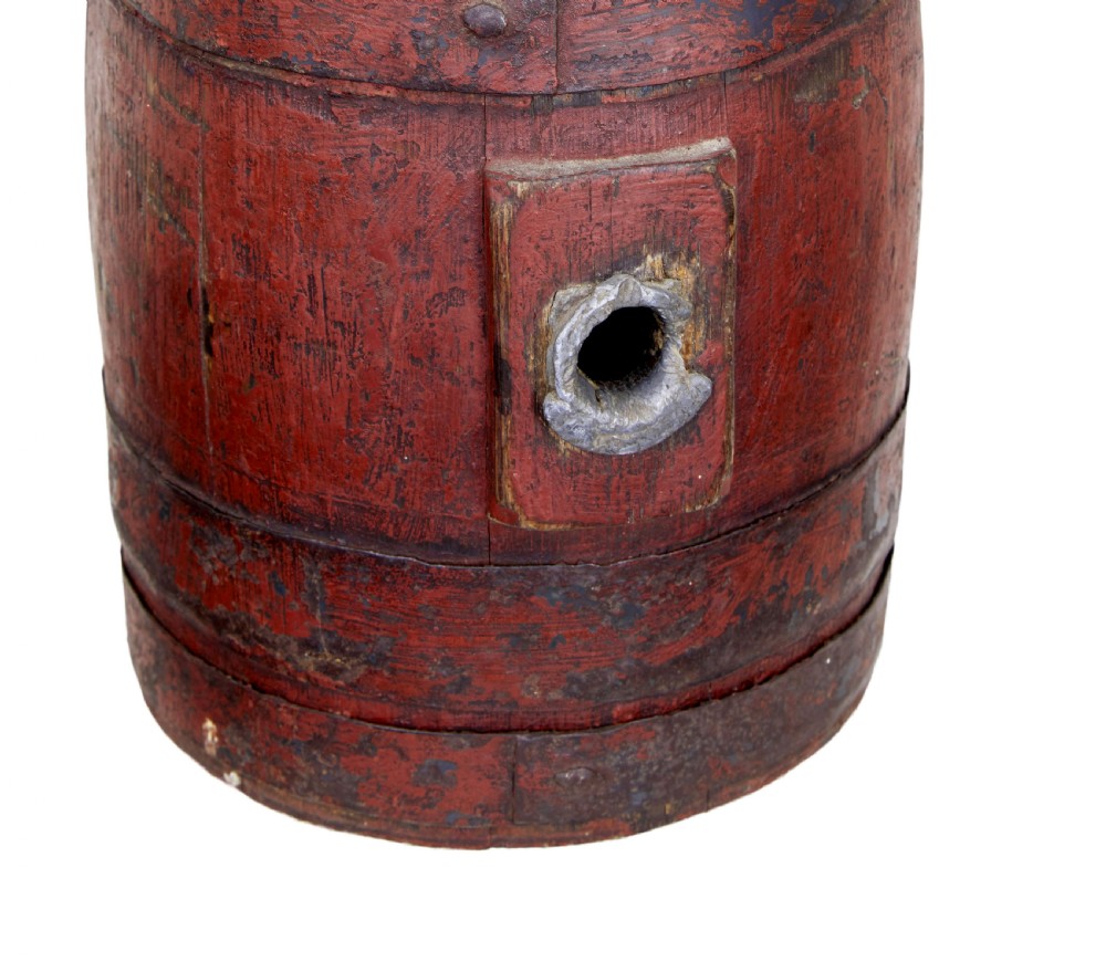 A 19th-century Scandinavian oak barrel featuring distressed red painted staves, dark metal hoops, and a lead-lined side bung hole. View III