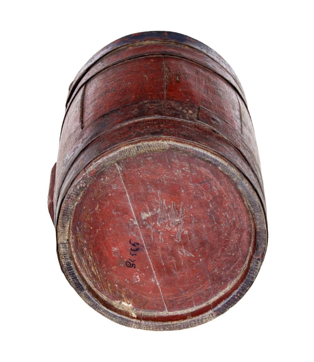 A 19th-century Scandinavian oak barrel featuring distressed red painted staves, dark metal hoops, and a lead-lined side bung hole. View V