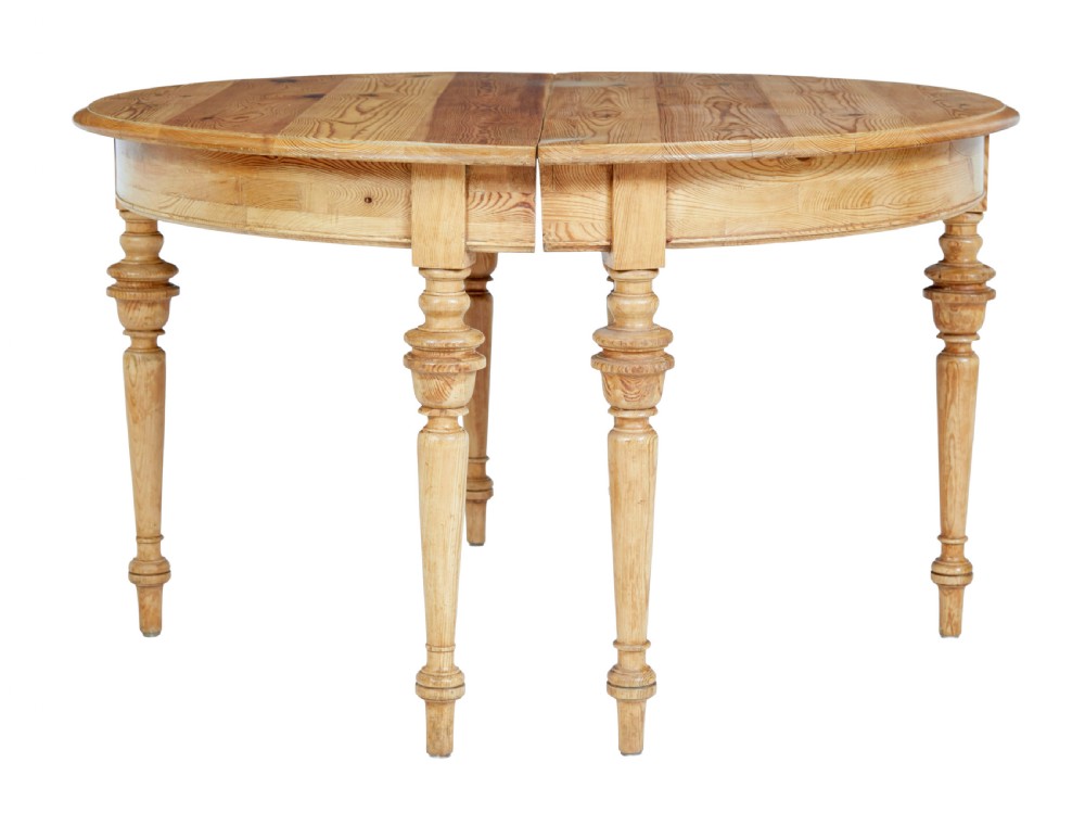 A pair of 19th-century Swedish pine demi-lune tables with turned legs placed together to form a circular top. View II