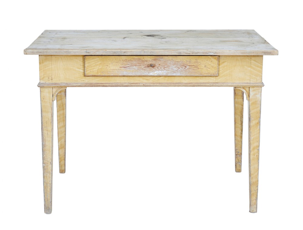 A 19th-century Swedish pine kitchen table featuring a yellow painted frame, square tapered legs, a single frieze drawer, and a scrubbed wooden tabletop. View IV