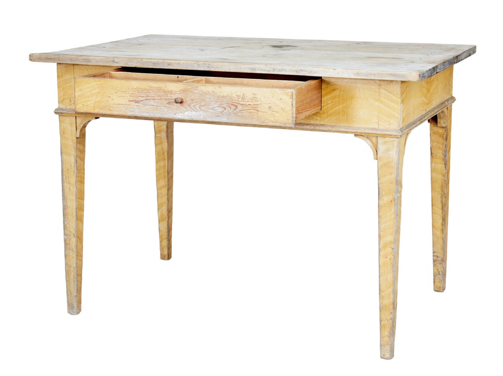A 19th-century Swedish pine kitchen table featuring a yellow painted frame, square tapered legs, a single frieze drawer, and a scrubbed wooden tabletop. View V