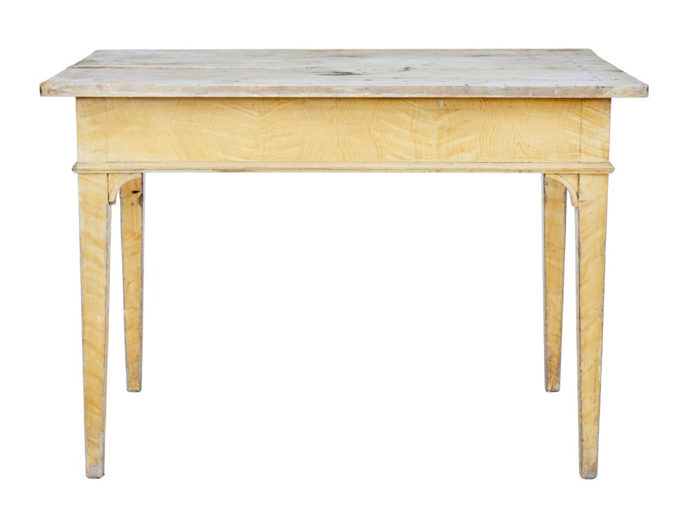 A 19th-century Swedish pine kitchen table featuring a yellow painted frame, square tapered legs, a single frieze drawer, and a scrubbed wooden tabletop. View VII