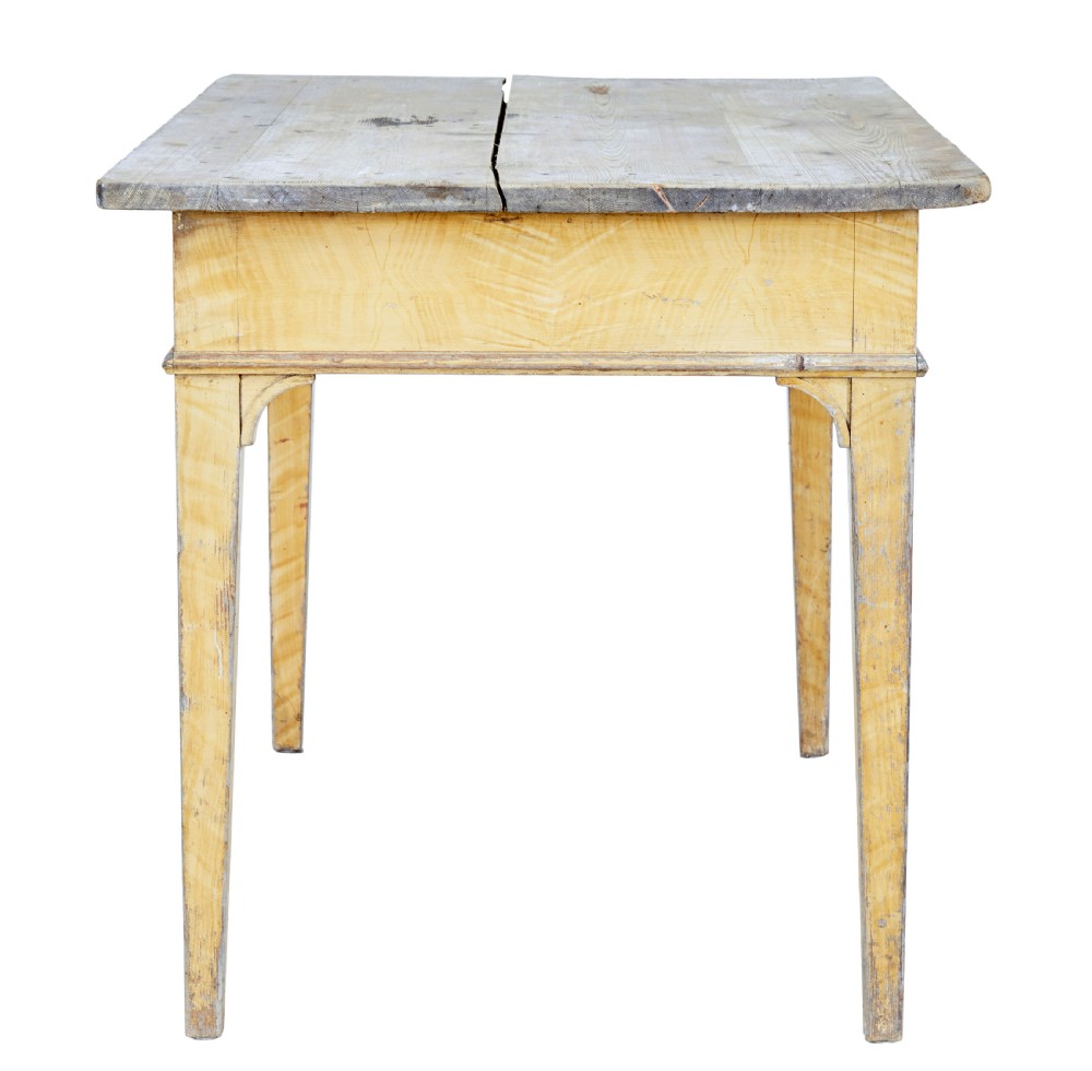 A 19th-century Swedish pine kitchen table featuring a yellow painted frame, square tapered legs, a single frieze drawer, and a scrubbed wooden tabletop. View VIII