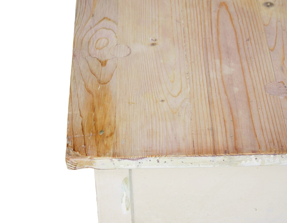 A 19th-century pine side table featuring a distressed off-white painted finish, a single frieze drawer with a wooden knob, and straight square legs supported by lower stretchers. View VIII