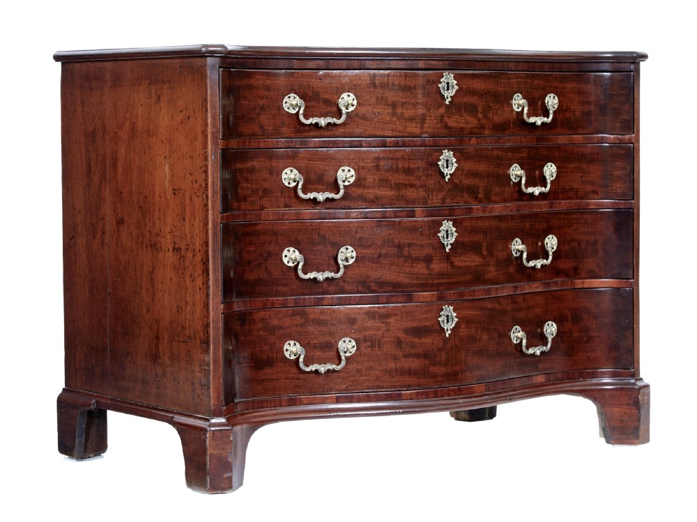 An eighteenth-century George III mahogany chest of drawers featuring a serpentine front, four graduated drawers with ornate brass handles, and bracket feet. View VII