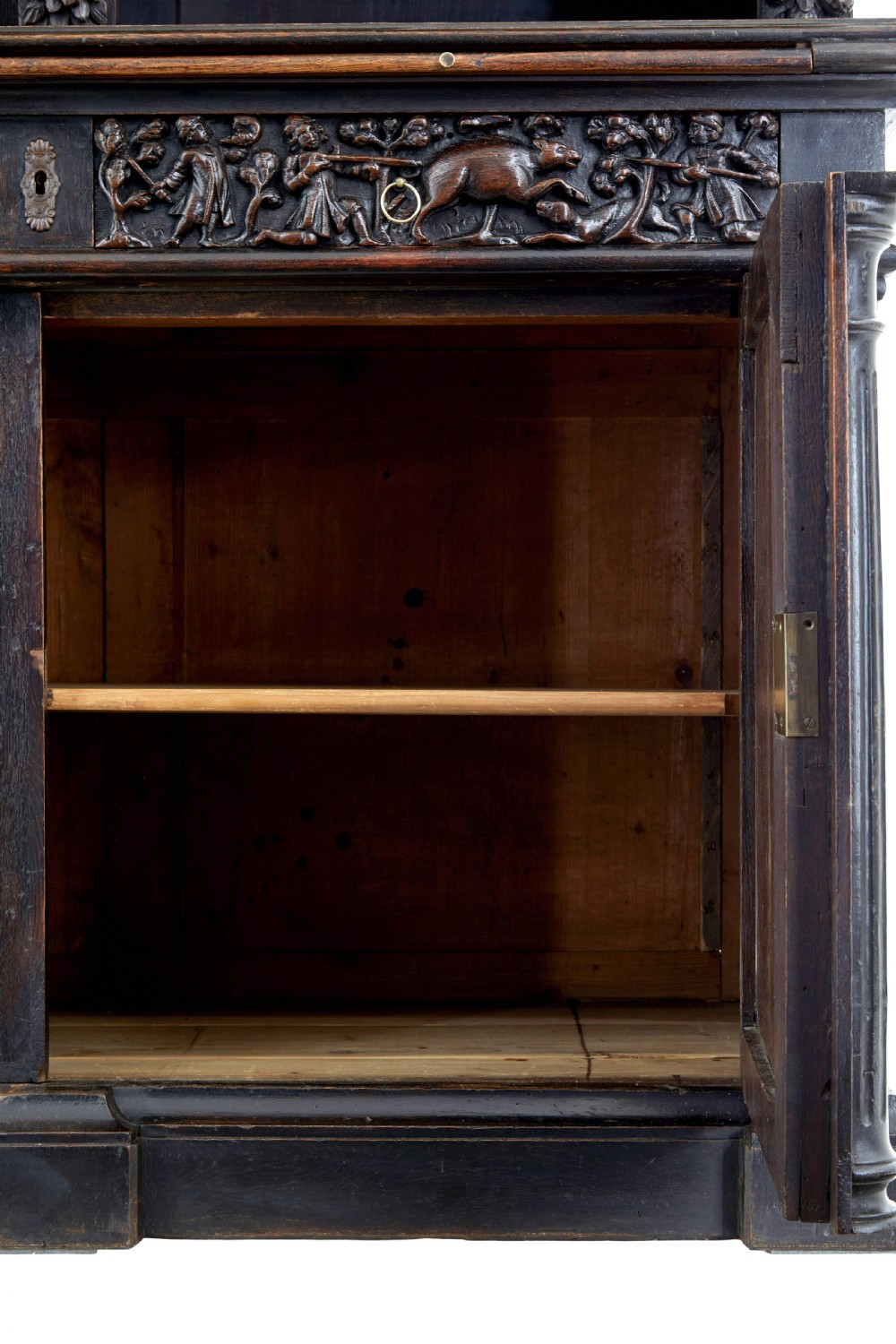 A large 19th-century Flemish dark carved oak cabinet featuring intricate relief panels depicting human figures and architectural details. View IX