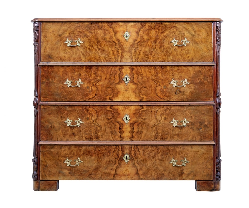 A nineteenth-century burr walnut secretaire chest of drawers featuring book-matched veneer drawer fronts and cast brass drop handles.