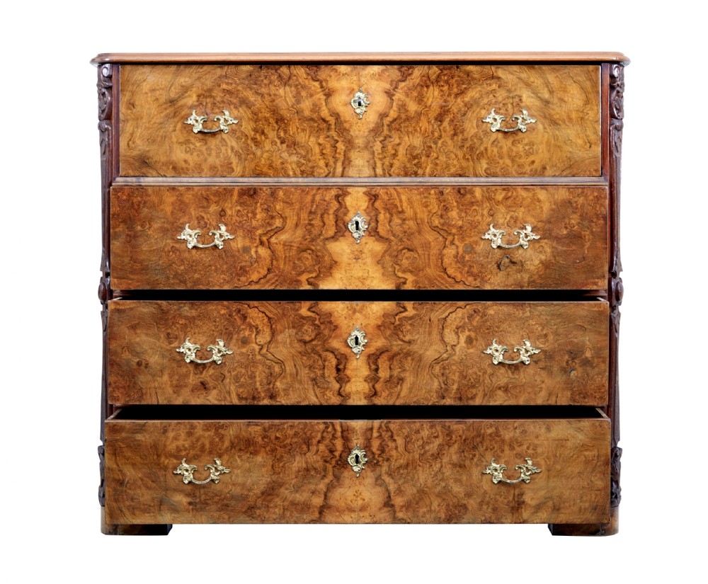 A nineteenth-century burr walnut secretaire chest of drawers featuring book-matched veneer drawer fronts and cast brass drop handles. View II