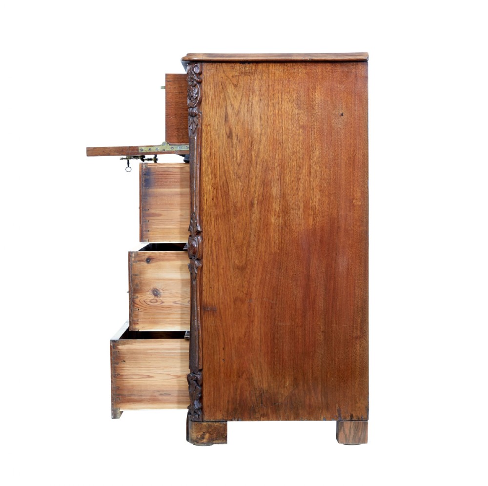 A nineteenth-century burr walnut secretaire chest of drawers featuring book-matched veneer drawer fronts and cast brass drop handles. View IV