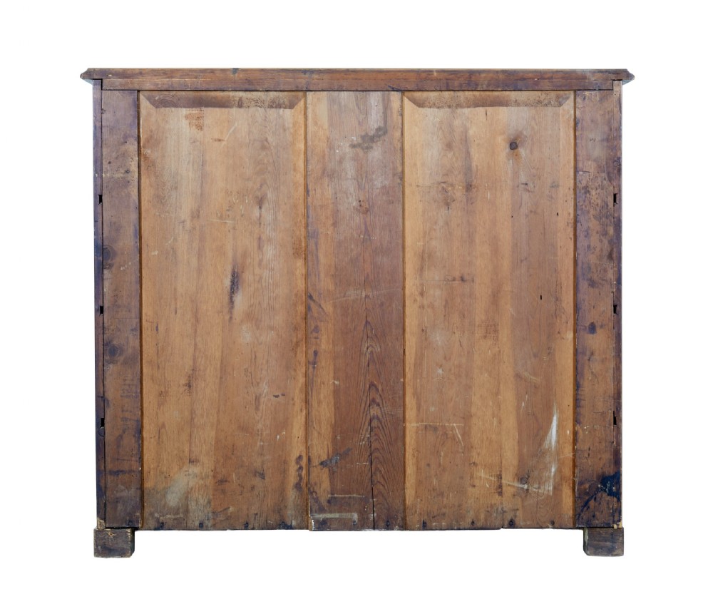 A nineteenth-century burr walnut secretaire chest of drawers featuring book-matched veneer drawer fronts and cast brass drop handles. View V