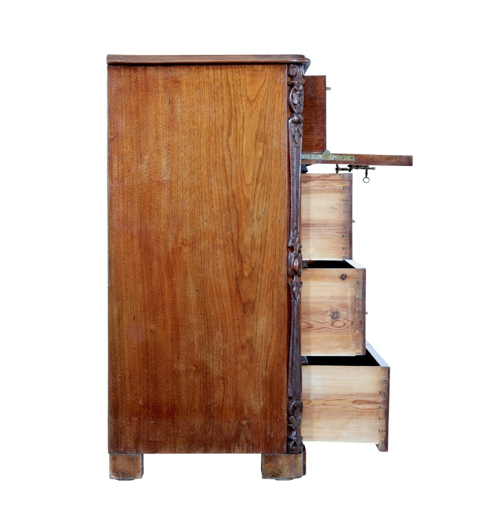 A nineteenth-century burr walnut secretaire chest of drawers featuring book-matched veneer drawer fronts and cast brass drop handles. View VI