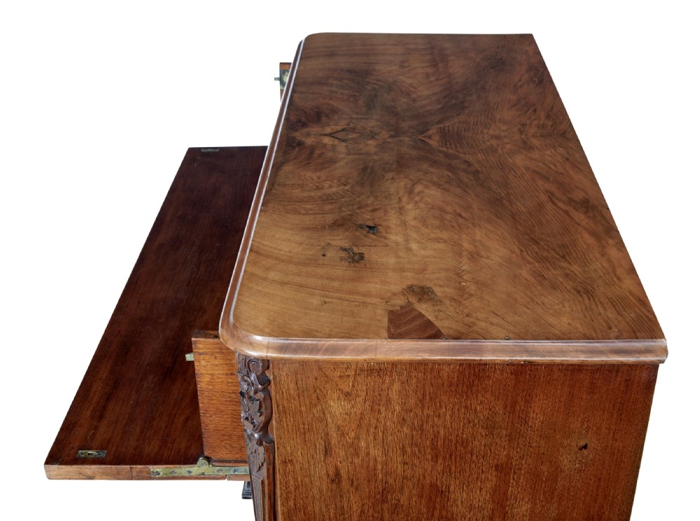 A nineteenth-century burr walnut secretaire chest of drawers featuring book-matched veneer drawer fronts and cast brass drop handles. View VIII