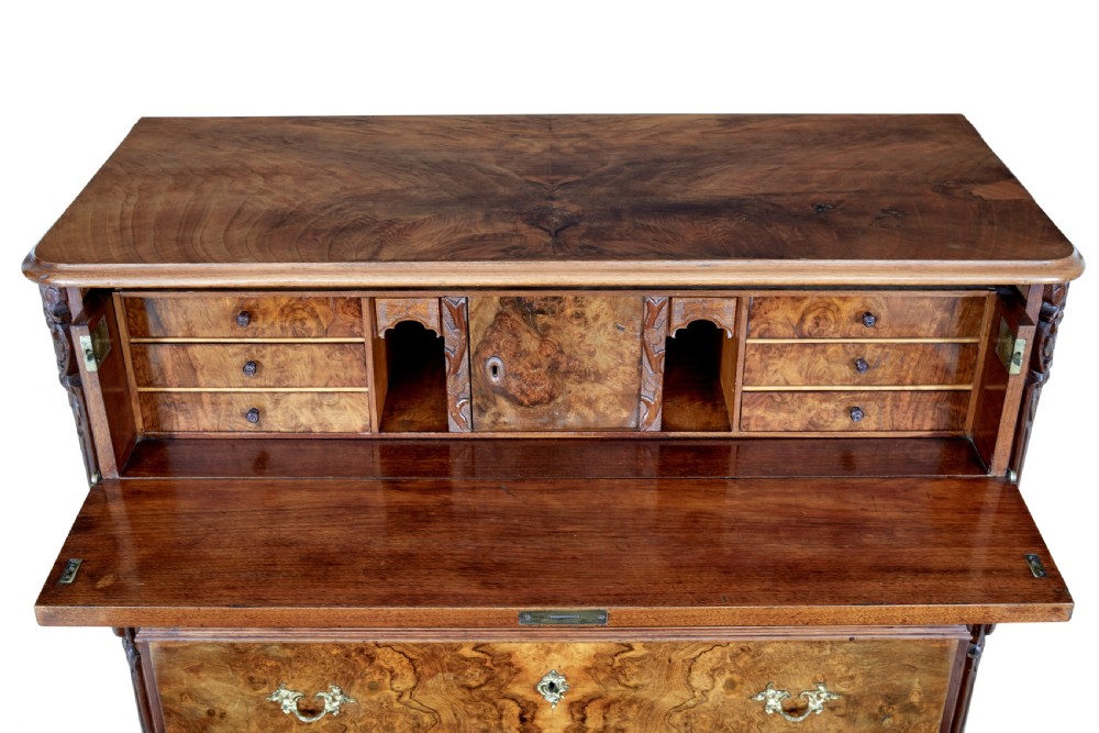 A nineteenth-century burr walnut secretaire chest of drawers featuring book-matched veneer drawer fronts and cast brass drop handles. View IX