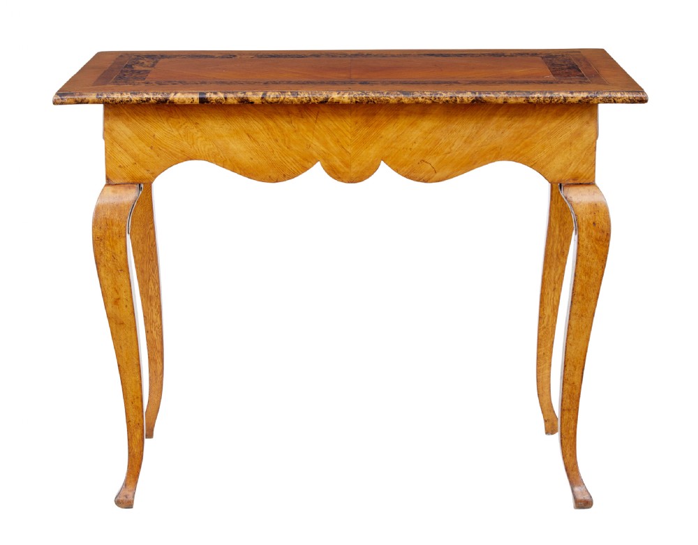 A mid 19th-century Swedish rectangular occasional table crafted from golden brown alder root wood with slender cabriole legs and a contoured apron. View II